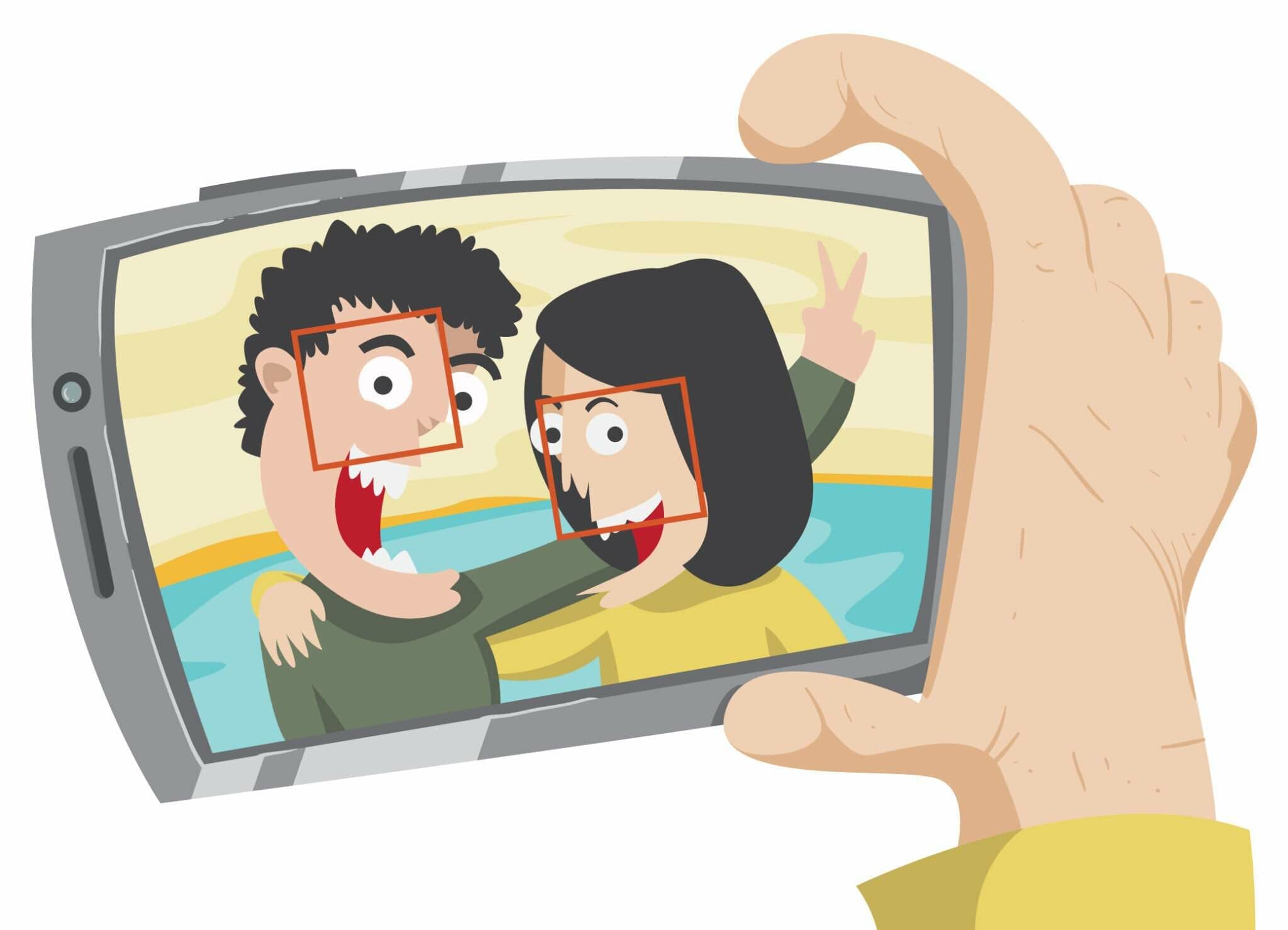 中国で携帯電話でお互いの写真を撮る男性と女性。