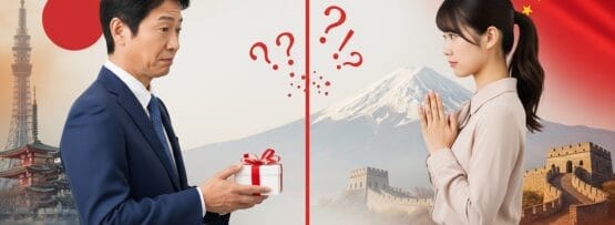スーツを着た男性が不安そうな女性に贈り物を差し出している。背景には日本と中国のランドマークが赤い線と疑問符で区切られて描かれている。.